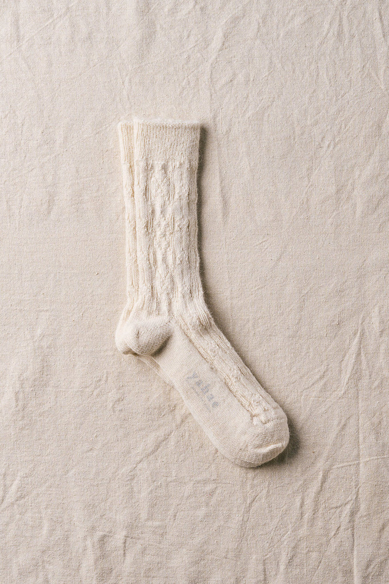 alpaca cable pattern socks in natural