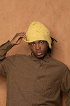flap beanie in speckled mustard