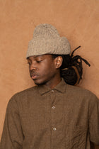 flap beanie in speckled beige