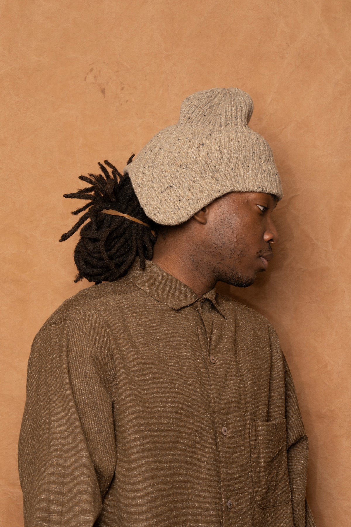 flap beanie in speckled beige