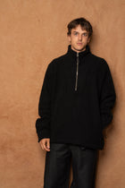 traveler 1/2 zip in black