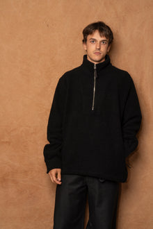 traveler 1/2 zip in black