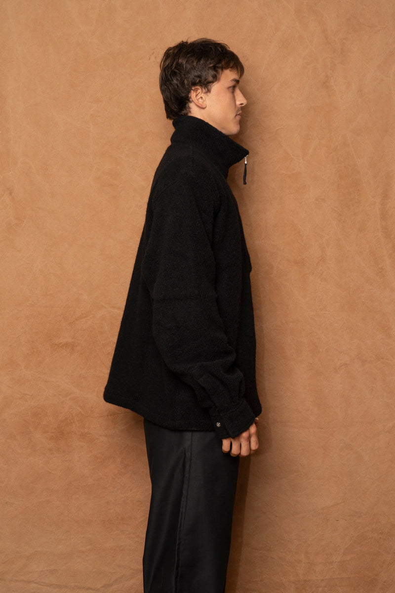 traveler 1/2 zip in black